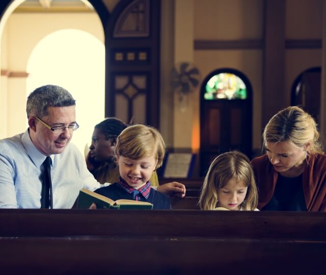 Two parents with two kids at church